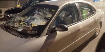 Most motorists will be prepared to admit that their car is not as clean as it could be. Above: A rubbish-filled car with only the driver's seat clear is seen in the US