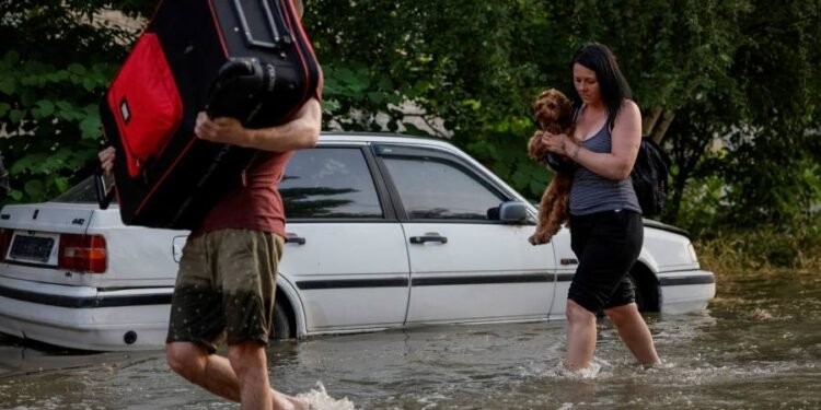Evacuations under way in southern Ukraine as flooding hits dozens of towns