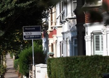 Property prices will continue to tumble in the short-term in the face of higher mortgage rates with 'little prospect of any turnaround in the immediate future' Royal Institution of Chartered Surveyors (RICS) said (Stock Image)