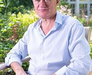 Investment titan: Richard relaxing in his London garden