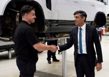 Shake on it: Prime Minister Rishi Sunak pictured visiting Land Rover in July