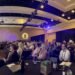 Executives and security professionals sit in a conference room at Black Hat USA listening with rapt attention to Omdia analysts
