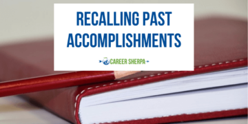 A notebook being used to record past accomplishments