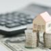 House on money pillars suggesting property investment