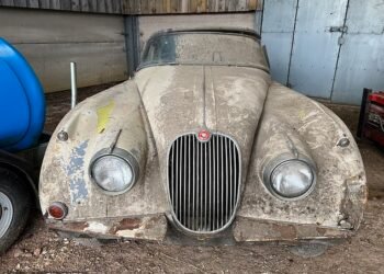The 1958 Jaguar XK150 drophead coupe belonged to a farmer who bought it as a restoration project about 30 years ago. But it languished at one end of his barn where his chickens roosted in it. Unable to move it, the owner decided to brick it in and built a breeze block wall to hide it