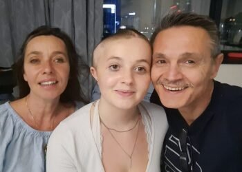 Recovering: Katya in hospital in Cape Town with mother Marsha and father Roberto after her second operation