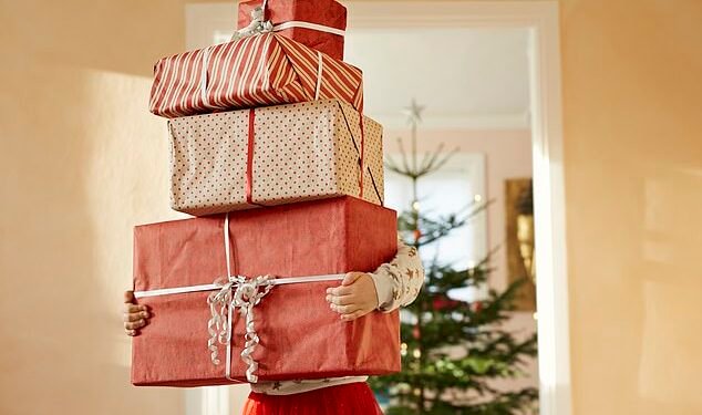 Cover the cost: Britons are predicted to spend an average of £569 on Christmas gifts and festivities this year