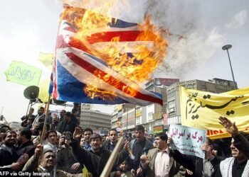 Iranian protesters burn a British flag during a demonstration against the US-led war, in Tehran in 2003