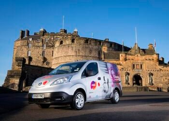 Striving for Net Zero: One of Mitie's 4,000-plus electric vans outside Edinburgh Castle