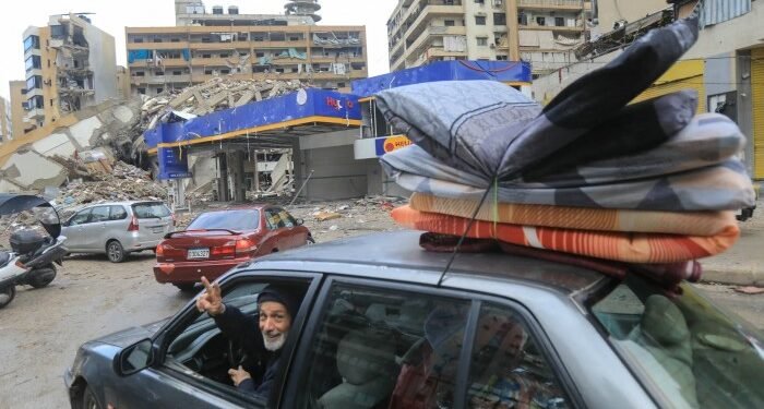 People return with their belongings to their homes in Beirut’s southern suburbs