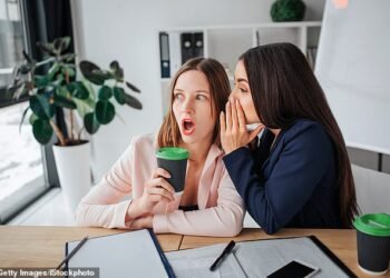 Office gossip can be uncomfortable for colleagues (picture posed by models)