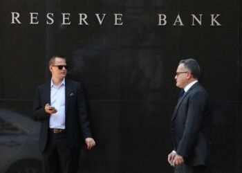 Australia's central bank cut rates, cautious on further easing