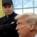 Elon Musk, standing, looks at Donald Trump, seated, who is speaking, in the Oval Office