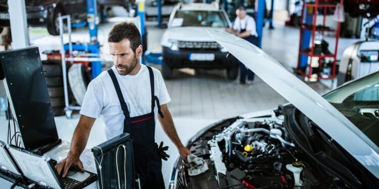 Person inspecting car engine
