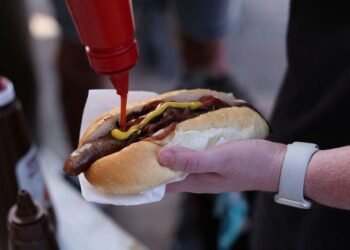 Australians sizzle on election day with 'democracy sausage' and 'budgy smugglers'