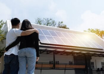 Couple looking at solar panels.