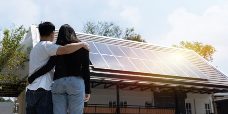 Couple looking at solar panels.