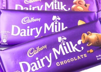 Counting its profits: More than 70 MPs and peers have accused Cadbury owner of 'funding Russia's war machine' by continuing to trade in the country
