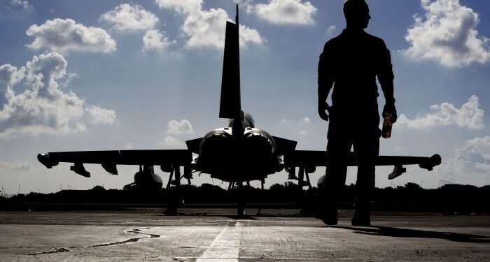 A British soldier and a Eurofighter Typhoon fighter jet at Royal Air Force’s Akrotiri base in Cyprus,