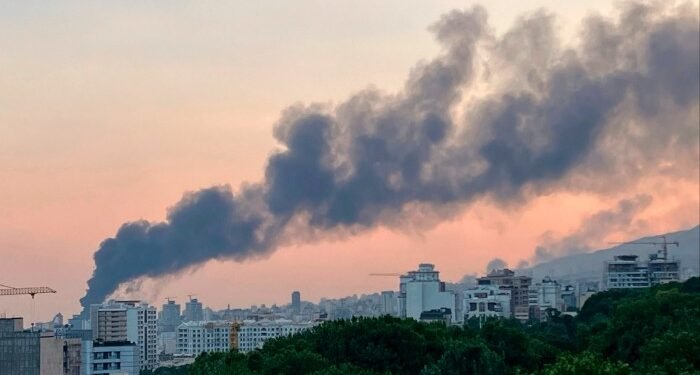 Smoke rises from the building of Iran’s state-run television after an Israeli strike in Tehran on Monday