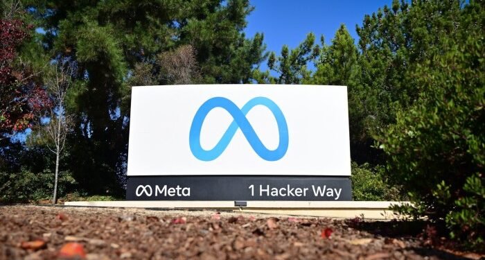 The Meta logo marks the entrance of their corporate headquarters in Menlo Park, California