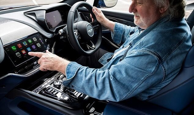 Apple of his eye: Ray tries out the new Apple Car Play Ultra dashboard system