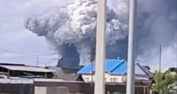 Smoke rises over Sredny in Russia’s Irkutsk region after a drone strike