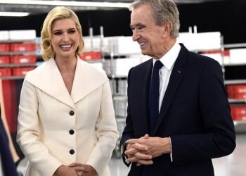 Putting on a brave face: The wealth of Bernard Arnault, pictured with Ivanka Trump, has fallen by more than £15billion this year