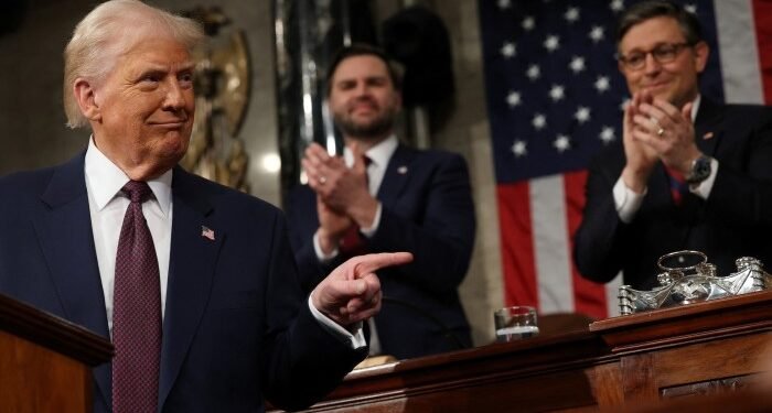 Vice-president JD Vance and Speaker of the House Mike Johnson applaud as US President Donald Trump addresses a joint session of Congress