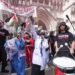 Protesters outside the Royal Courts of Justice on The Strand, central London, ahead of a hearing over whether proscribing of Palestine Action should be temporarily blocked
