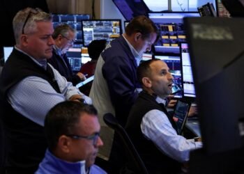 Nasdaq, S&P 500 end lower as investors sell tech, buy less pricey sectors