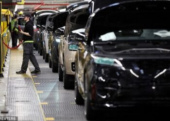 Hacked: Land Rover vehicles roll down the production line at the Jaguar Land Rover factory in Solihull. The company has been hit by a cyber attack that has forced it to suspend operations