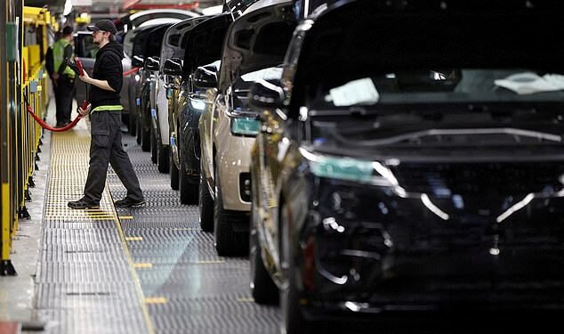 Hacked: Land Rover vehicles roll down the production line at the Jaguar Land Rover factory in Solihull. The company has been hit by a cyber attack that has forced it to suspend operations