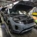 Staff are seen assembling Range Rover Evoque SUVs on the production line at Jaguar Land Rover's Halewood factory in Liverpool in December 2022 - the plant was closed on Monday
