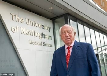 World-leading spinal expert Prof John Webb, outside The University of Nottingham Medical School, attached to Queen's Medical Centre in the city, where he once taught