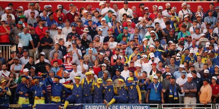 Trump met with cheers at Ryder Cup as US team gets off to rough start