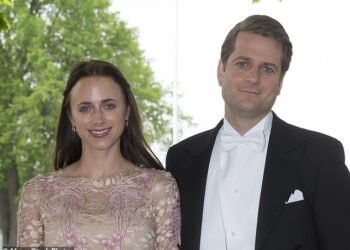 Being 'honest': Sebastian Siemiatkowski (pictured with wife, Nina) said artificial intelligence has allowed him to cut his workforce in half and halt hiring