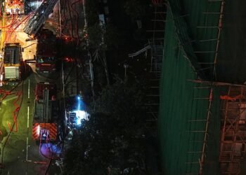 Anger simmers over Hong Kong deadly blaze as Beijing warns against "disruption"