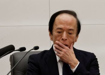 Bank of Japan drops fresh hints of near-term rate hike as yen slides