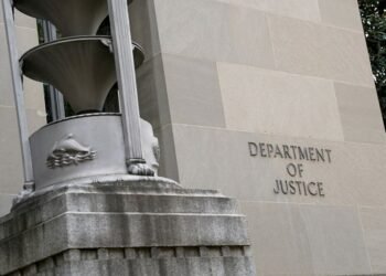 Former FBI employee sues DOJ, says unjustly fired over Pride Flag display