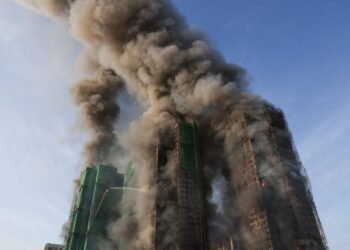 Four dead after fire engulfs residential high-rise buildings in Hong Kong