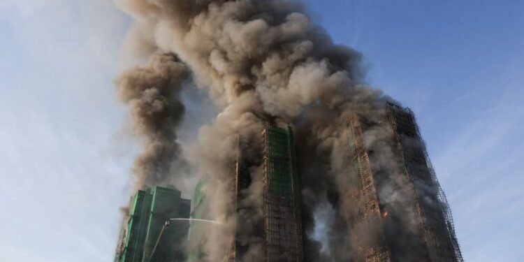 Four dead after fire engulfs residential high-rise buildings in Hong Kong