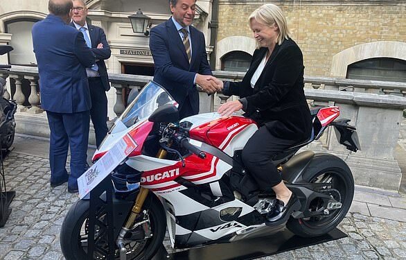 In the fast lane: Anna Botting pictured with Ducati UK managing director Fabrizio Cazzoli