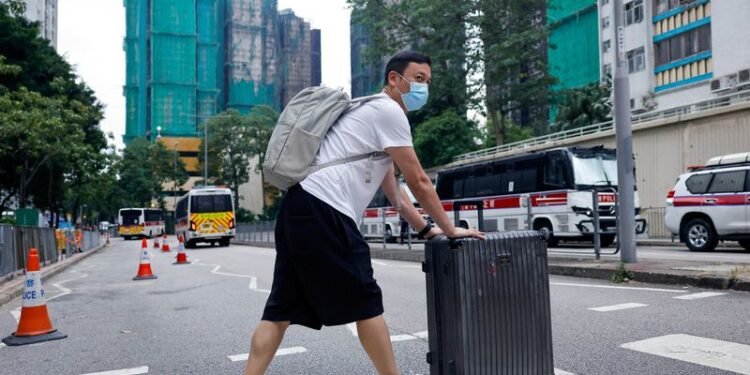 'Highly traumatised': Hong Kong presses ahead with elections after deadly fire
