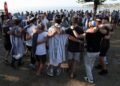 Australian Jews hold prayers, hundreds of surfers paddle out at Bondi to honour shooting victims
