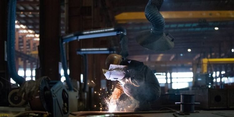 China’s factory activity snaps eight-month slump on festive stockpiling