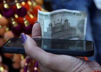 Rupee cracks below 90 to the dollar, hit by tariffs, capital outflows