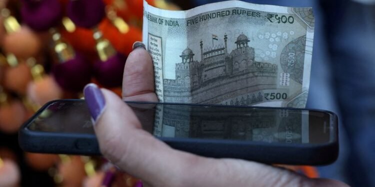 Rupee cracks below 90 to the dollar, hit by tariffs, capital outflows