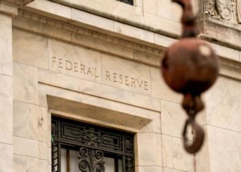 Fed holds rates steady as expected, but sees elevated inflation