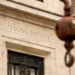 Fed holds rates steady as expected, but sees elevated inflation